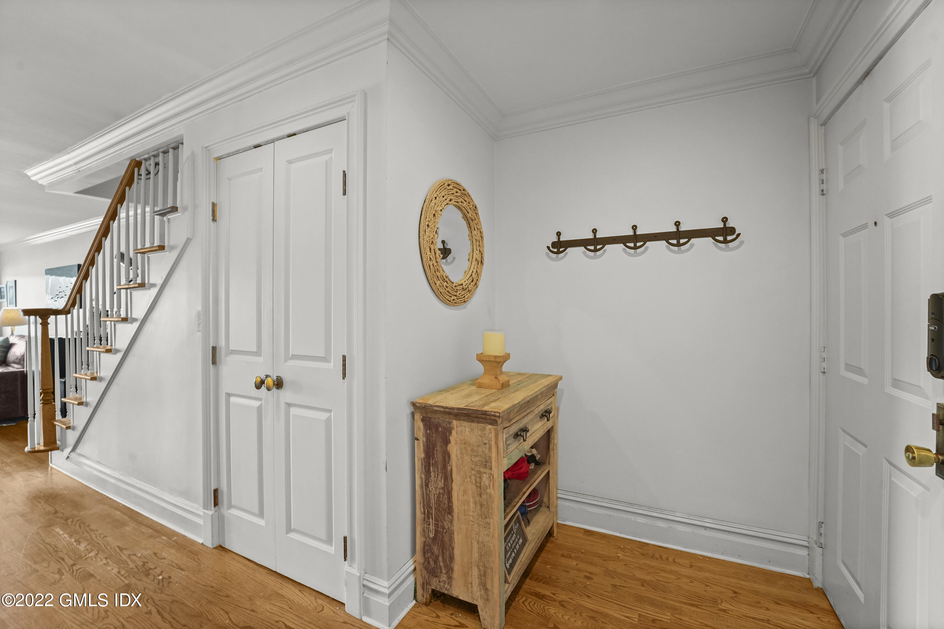 15 River Road, Unit 211 Cos Cob, CT 06807 - Photo 6 of 21 a view of an entryway with staircase
