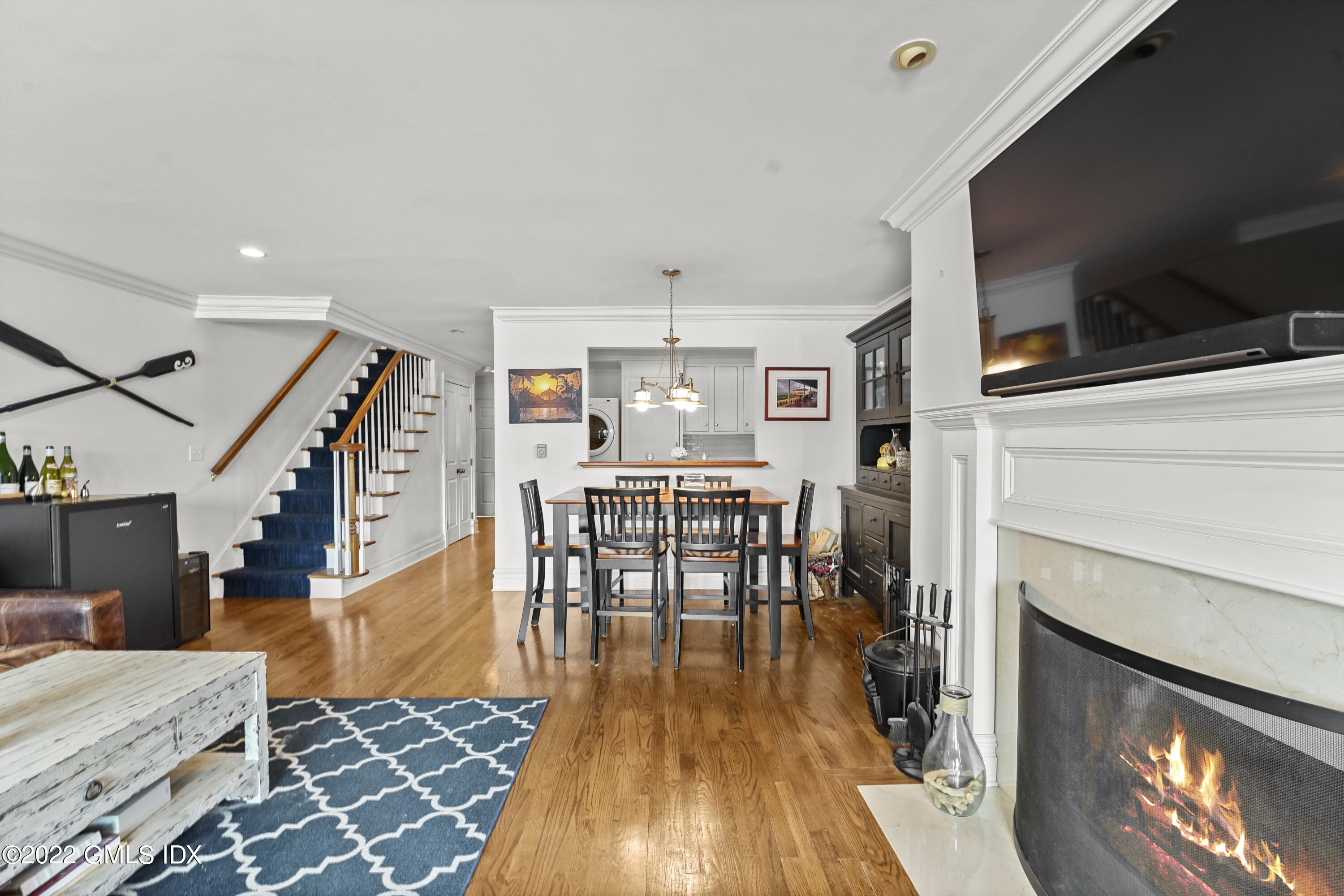 15 River Road, Unit 211 Cos Cob, CT 06807 - Photo 10 of 21 a dining room with furniture and wooden floor