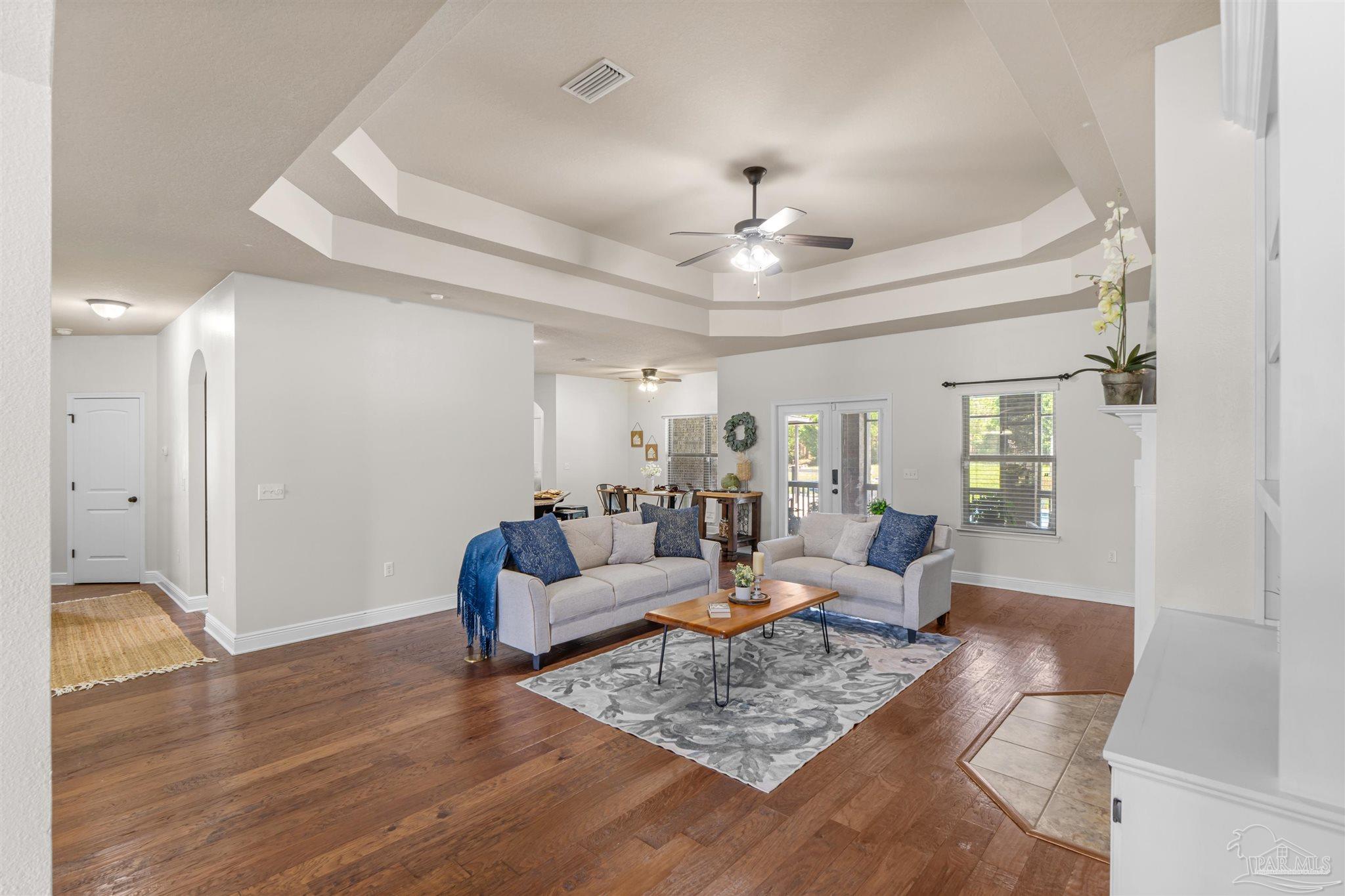 2698 Tulip Hill Road Pace, FL 32571 - Photo 13 of 65 a living room with furniture and wooden floor