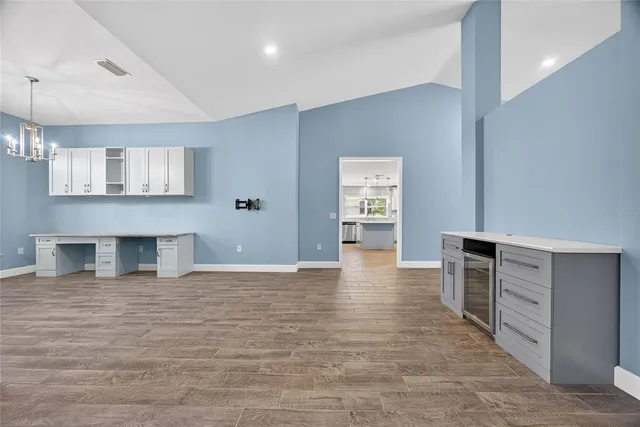 a view of a kitchen cabinets and wooden floor