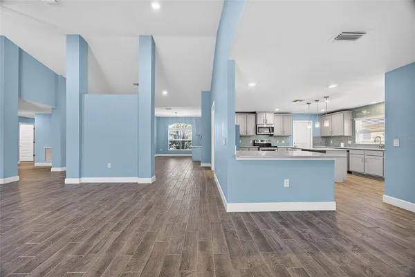 a view of kitchen with wooden floor
