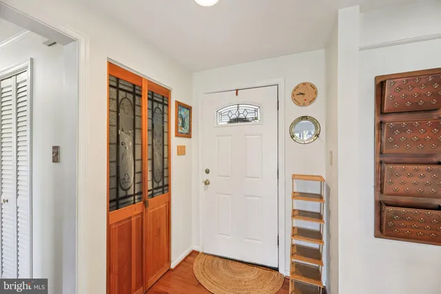 a kitchen with stainless steel appliances a refrigerator sink and cabinets