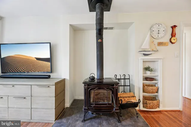 a kitchen with stainless steel appliances granite countertop a refrigerator a stove and a sink with cabinets