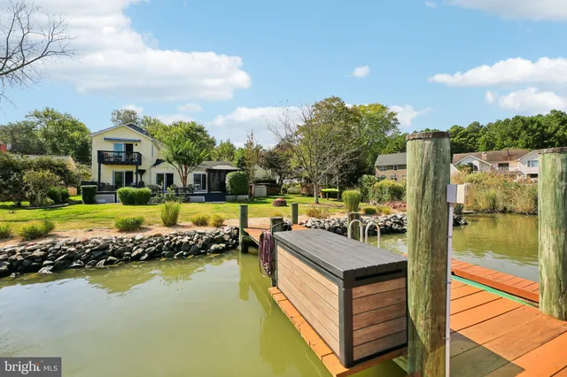 an aerial view of a house with a lake view