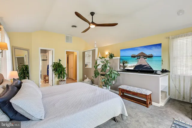 a view of a swimming pool with a patio and a yard