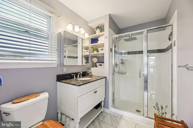 a front view of house with yard and trees