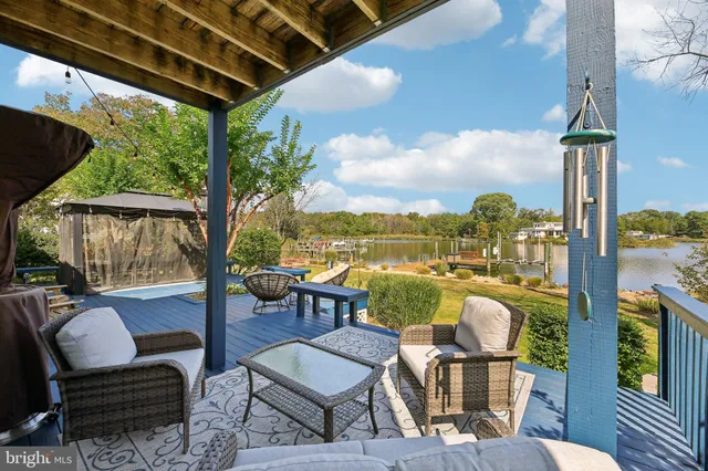 an aerial view of a house with a lake view