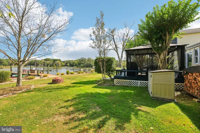 an aerial view of a house with yard swimming pool and outdoor seating