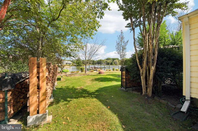 an aerial view of multiple house with lake view