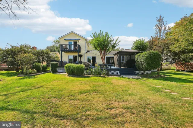 an aerial view of a house with yard swimming pool and outdoor seating