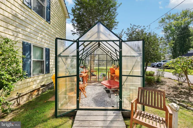 a view of a livingroom with furniture window and wooden floor