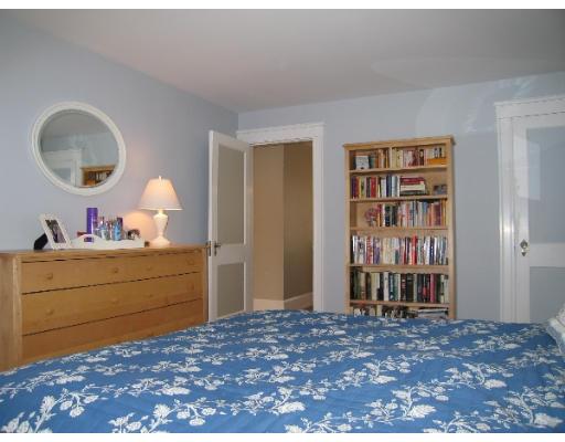 81 Gleason Road Lexington, MA 02420 - Photo 15 of 18 a room with a bed and a mirror