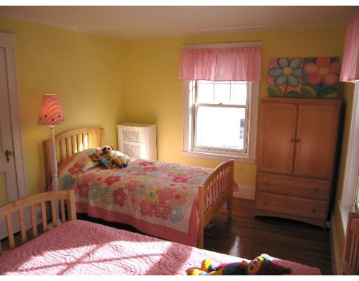 81 Gleason Road Lexington, MA 02420 - Photo 17 of 18 a bedroom with a bed and a window