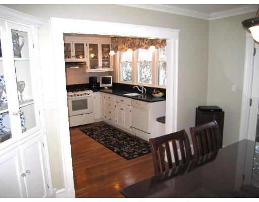 81 Gleason Road Lexington, MA 02420 - Photo 7 of 18 a kitchen with granite countertop a stove a sink and a refrigerator