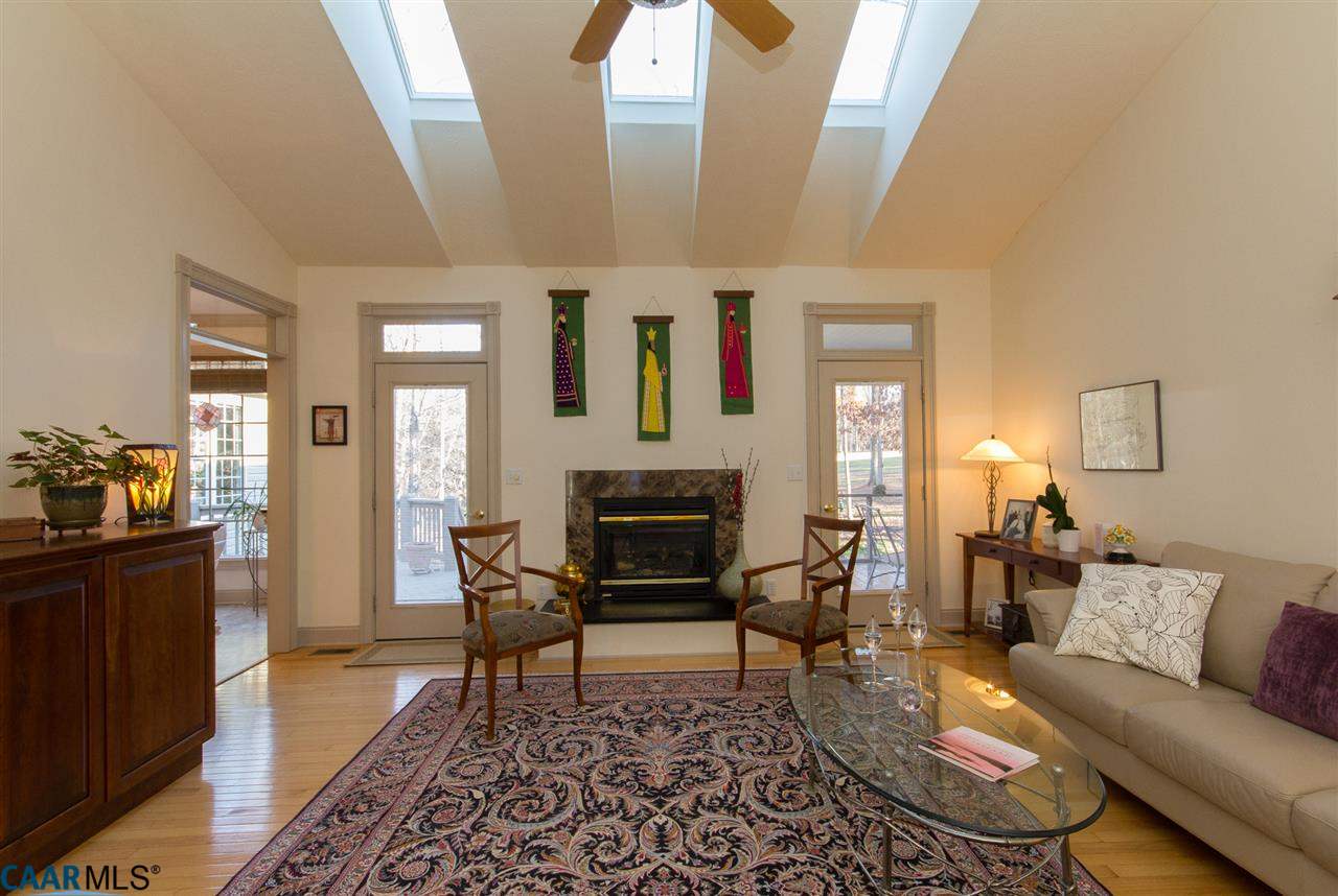 Vaulted Greatroom w/3 Skylights, Hardwoods, Gas-log Fireplace, & Walk-out to Back Deck & Screened Porch