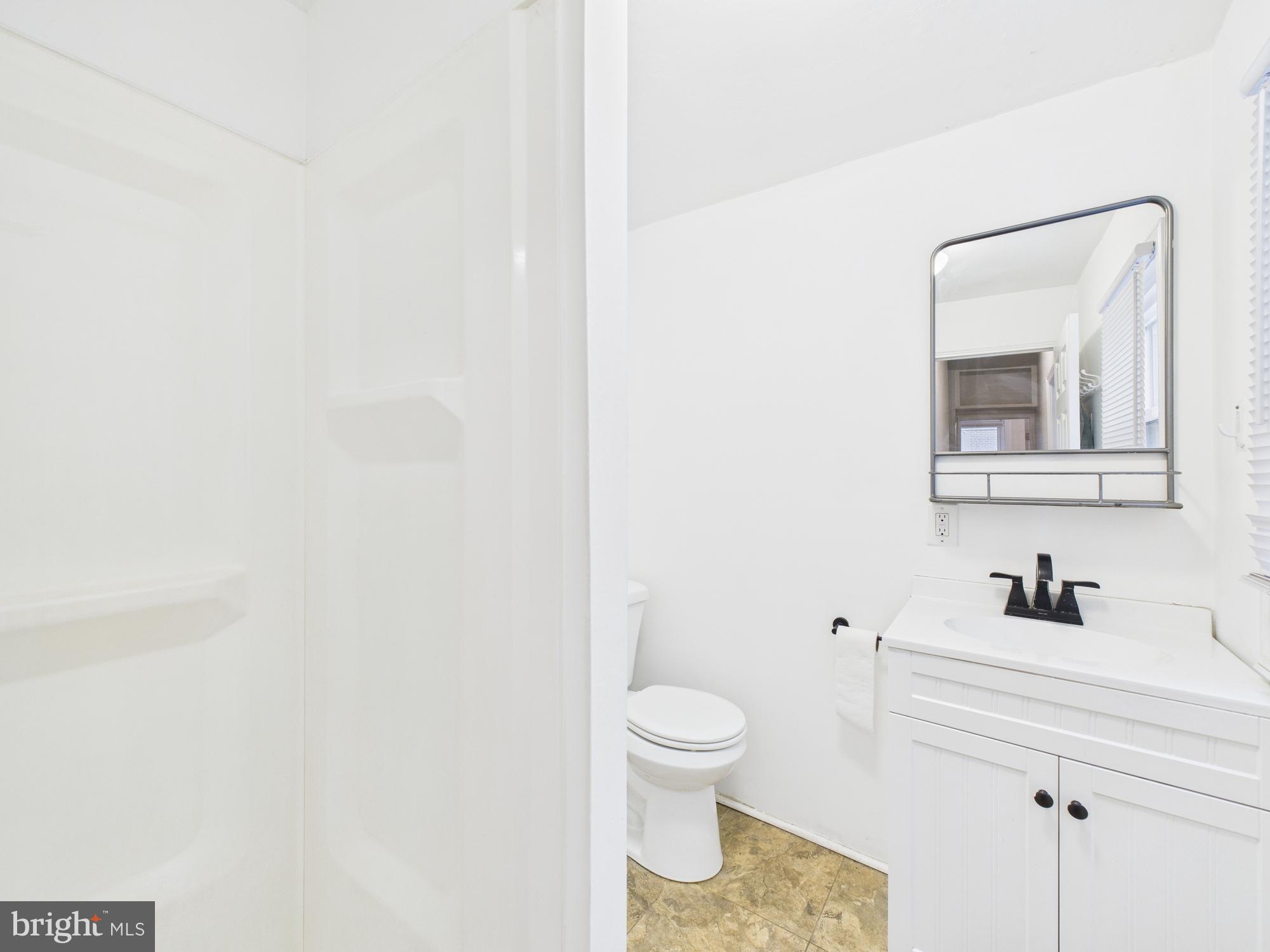 1825 Carlton Street Philadelphia, PA 19103 - Photo 11 of 28 a white toilet sitting next to a bathroom sink