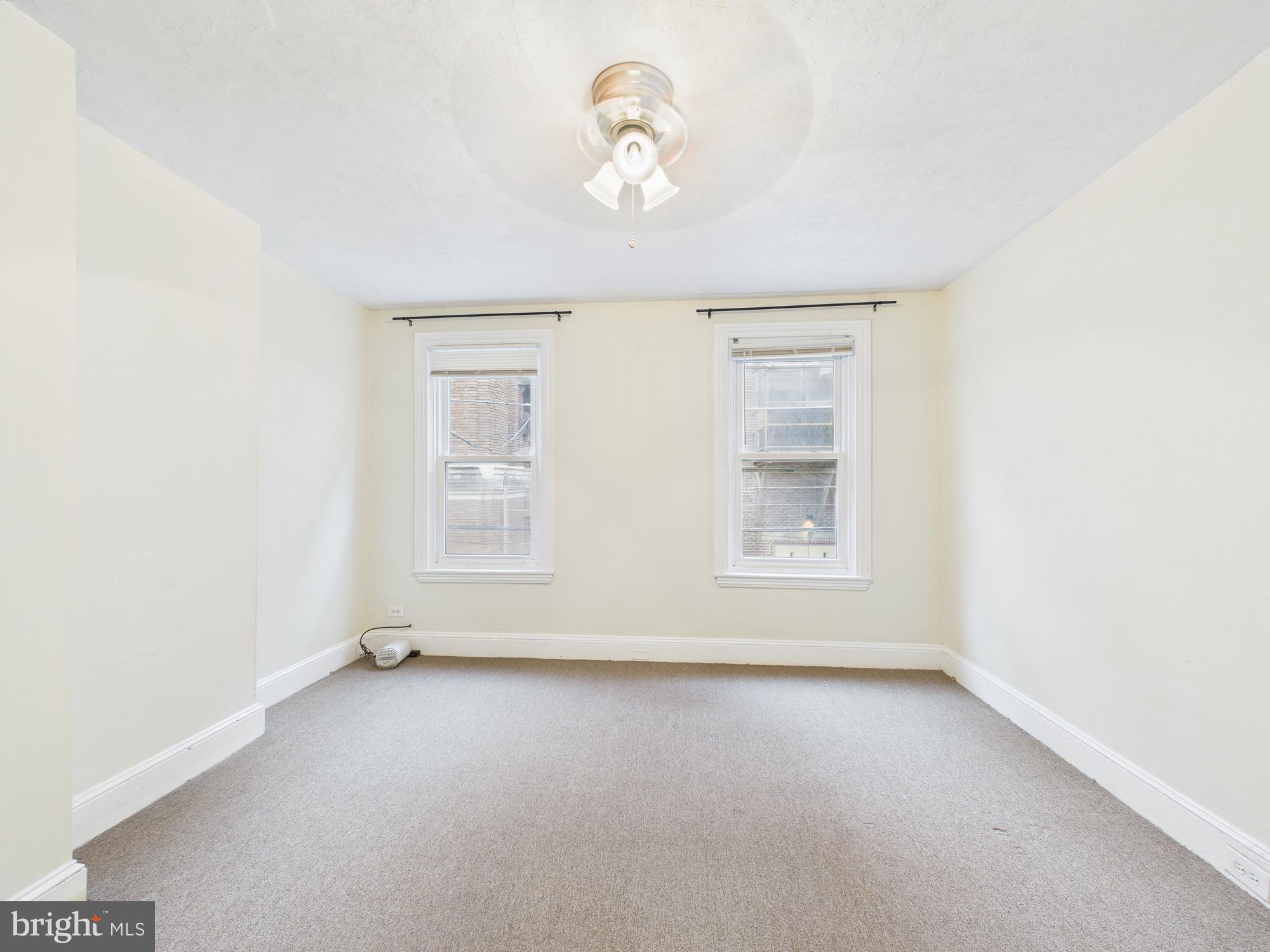 1825 Carlton Street Philadelphia, PA 19103 - Photo 13 of 28 an empty room with windows