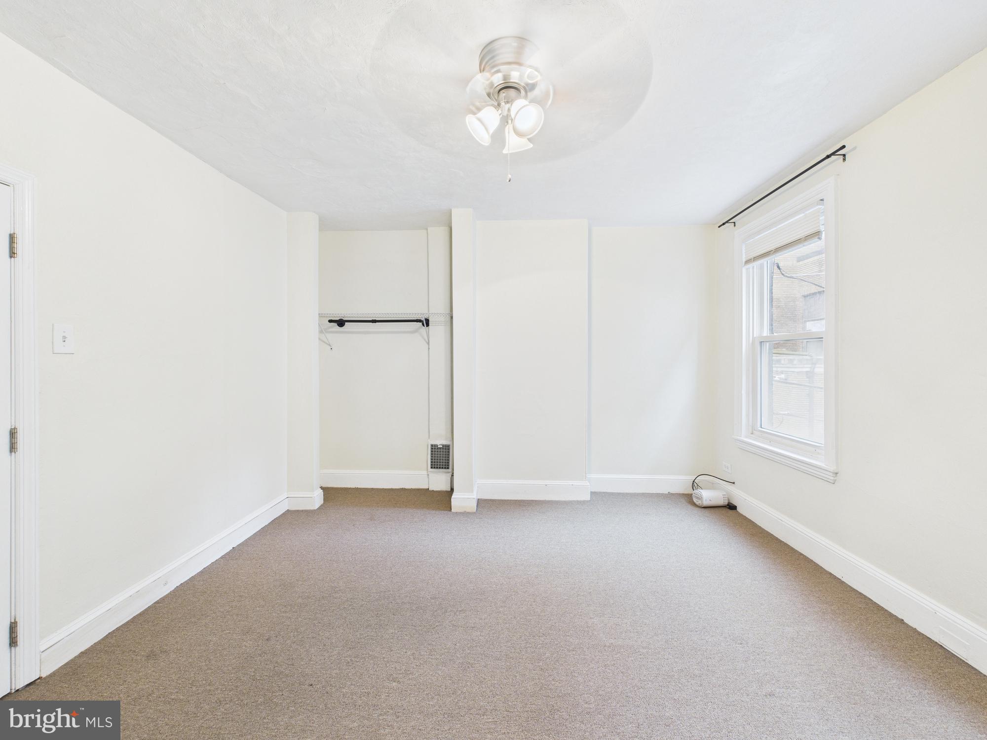 1825 Carlton Street Philadelphia, PA 19103 - Photo 14 of 28 a view of an empty room with a window