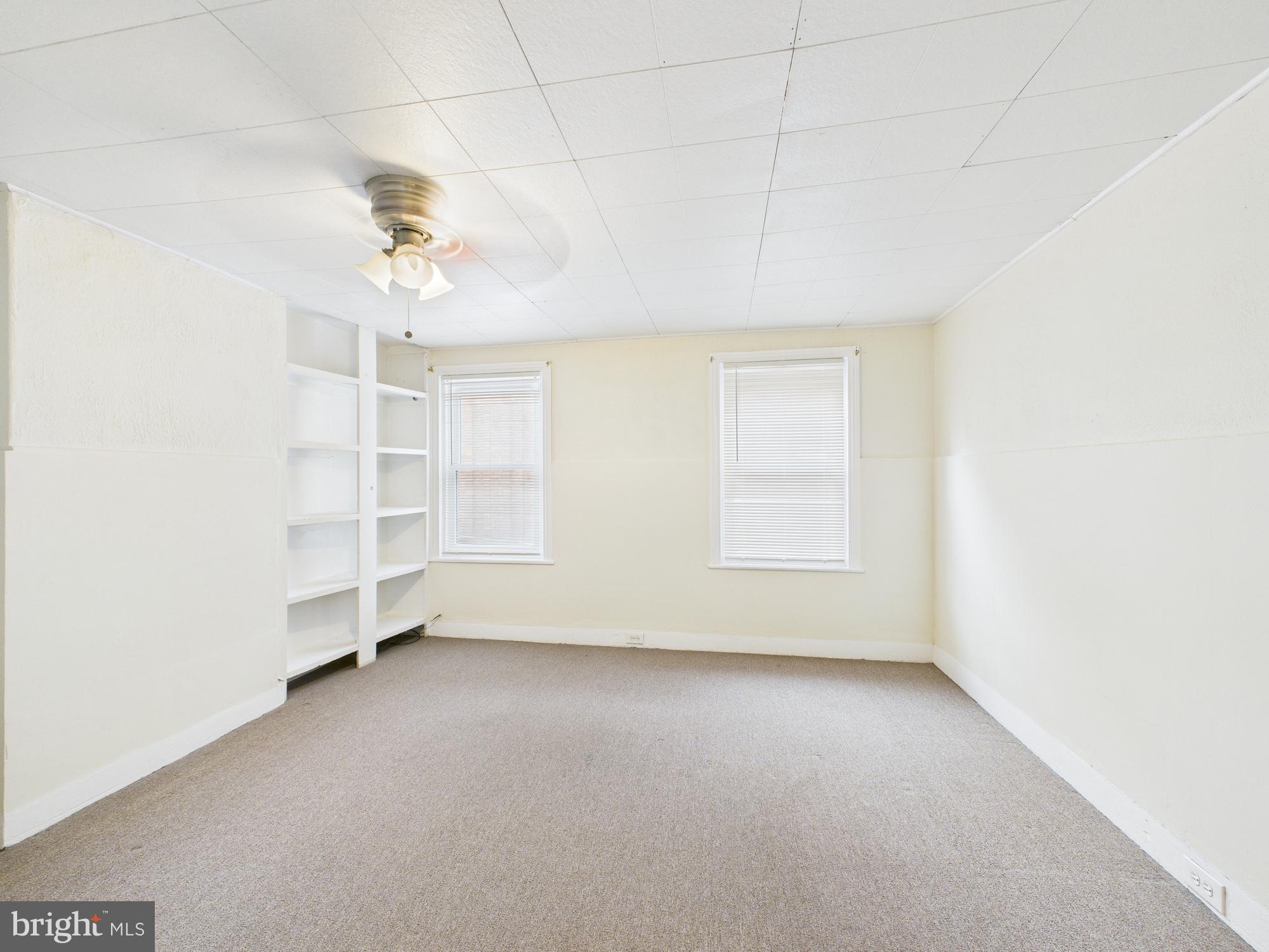 1825 Carlton Street Philadelphia, PA 19103 - Photo 21 of 28 an empty room with a empty space and windows