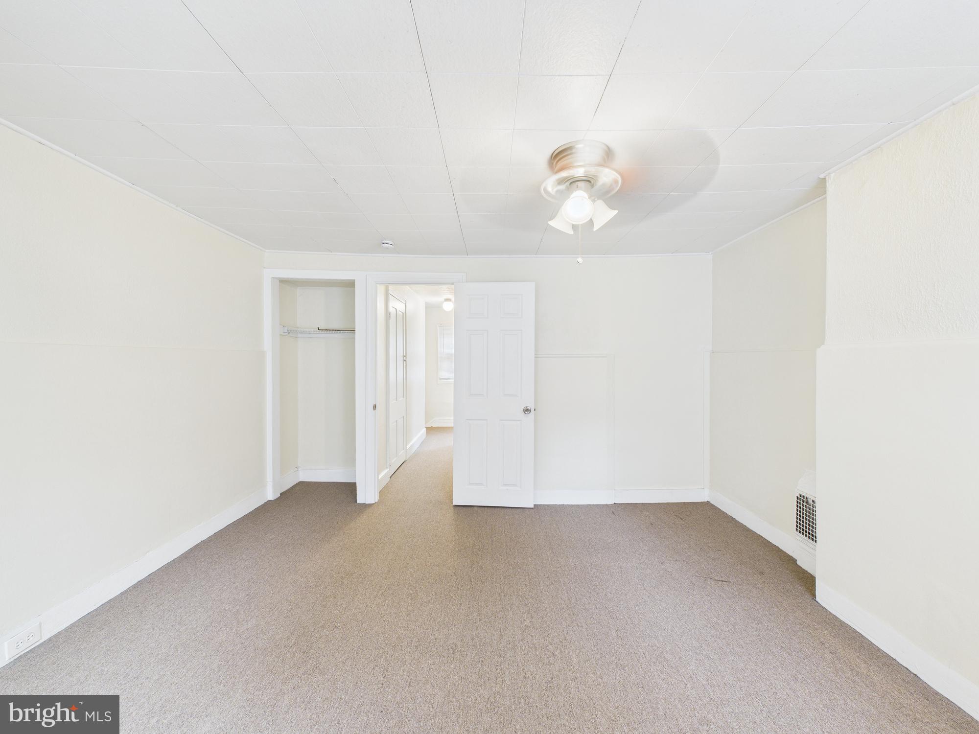 1825 Carlton Street Philadelphia, PA 19103 - Photo 24 of 28 wooden floor in an empty room with a window