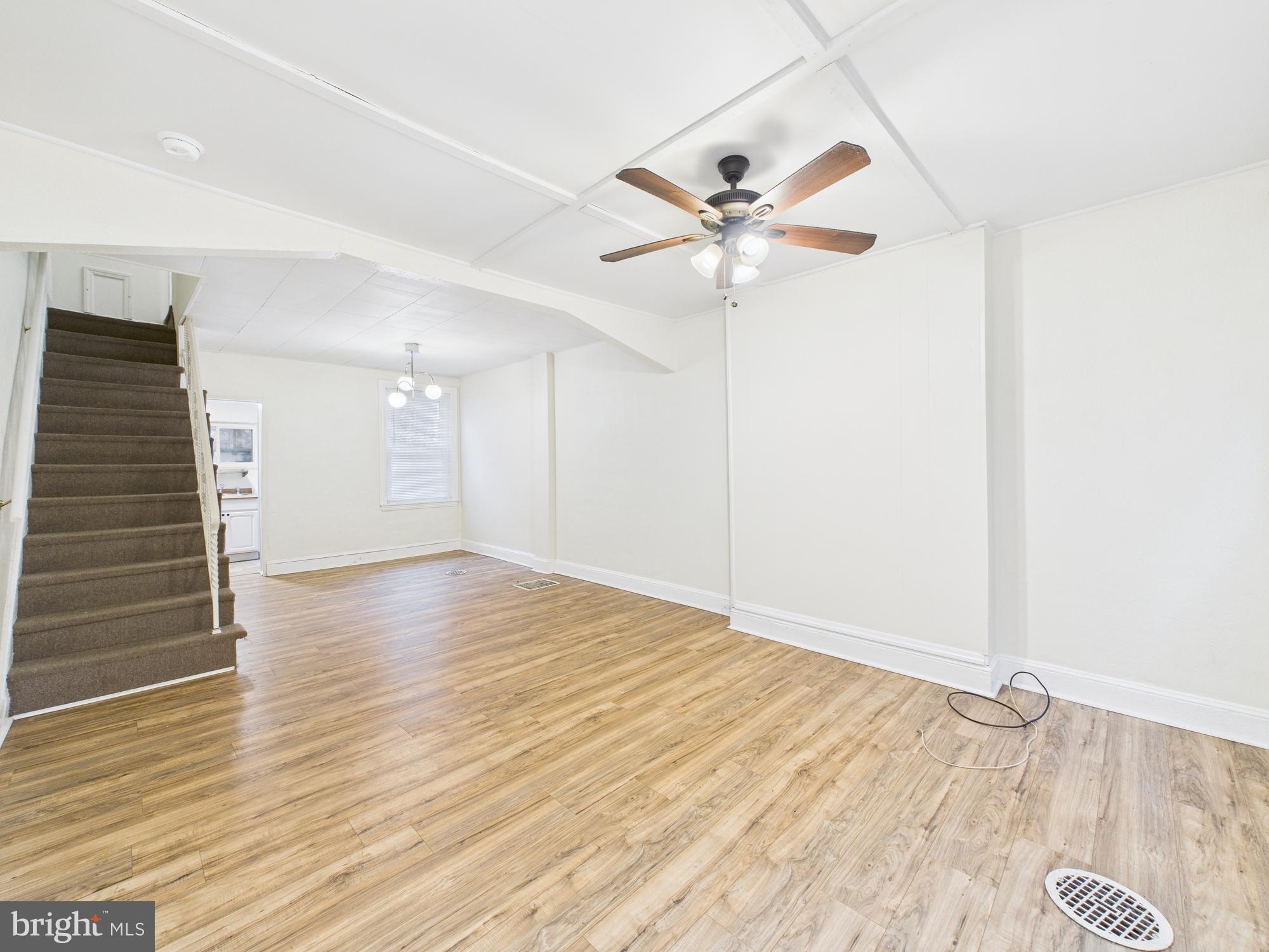 1825 Carlton Street Philadelphia, PA 19103 - Photo 6 of 28 an empty room with wooden floor fan and windows
