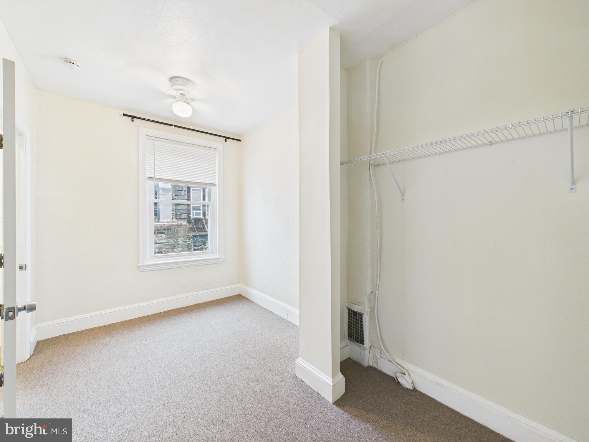 1825 Carlton Street Philadelphia, PA 19103 - Photo 10 of 28 a view of an empty room with a window