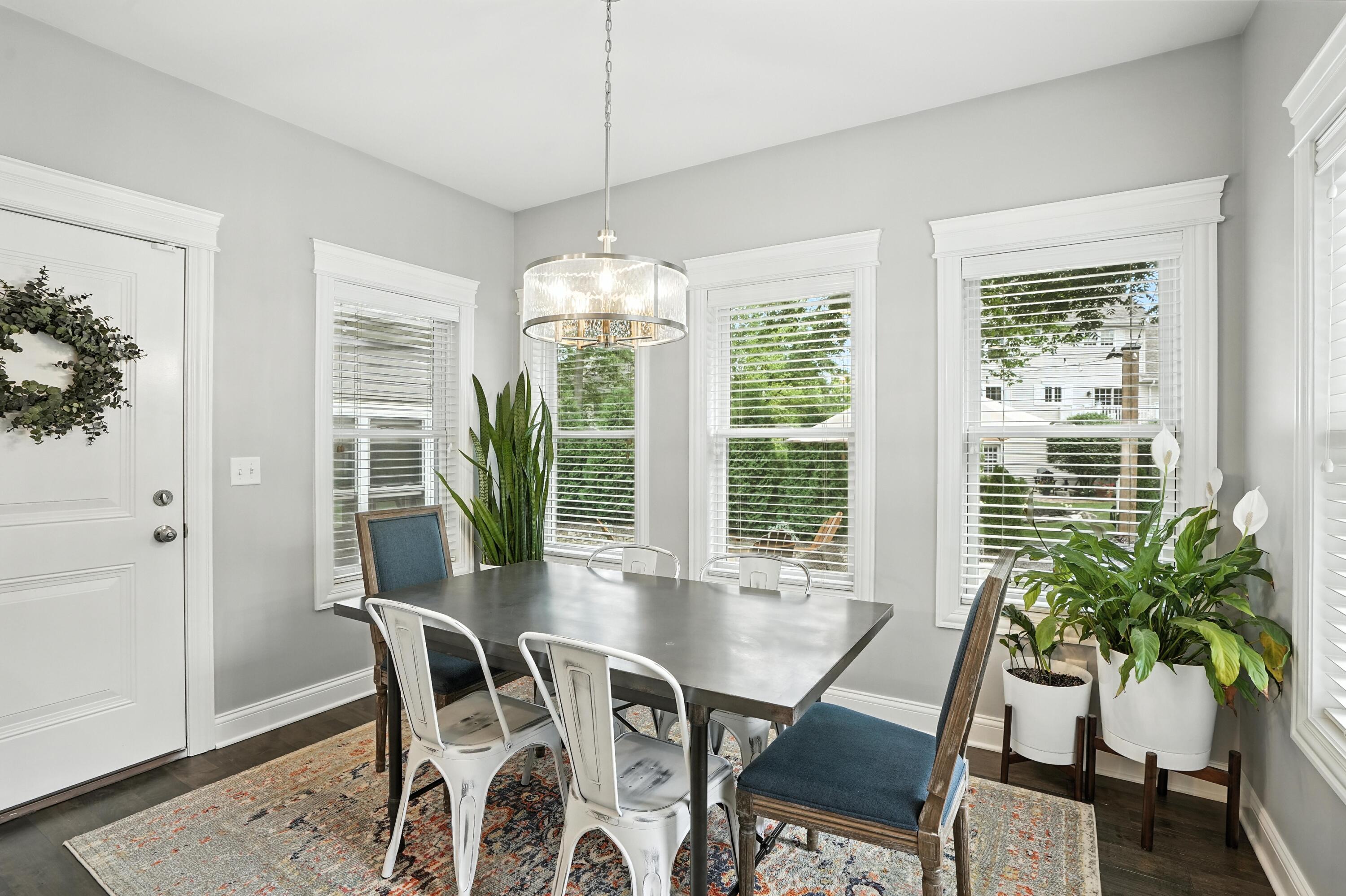 1285 Greenview Place Crown Point, IN 46307 - Photo 17 of 51 a view of a dining room with furniture window and wooden floor