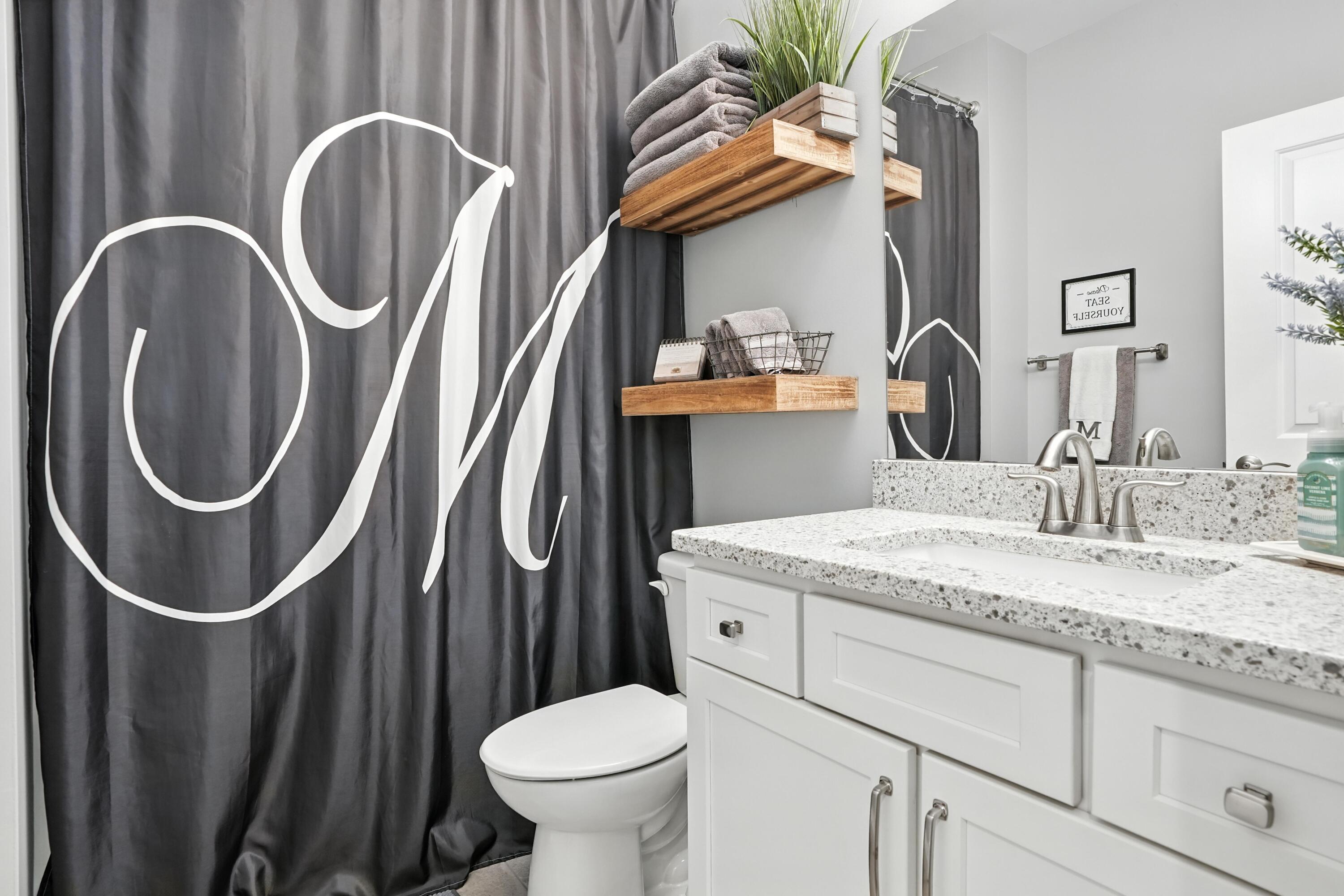 1285 Greenview Place Crown Point, IN 46307 - Photo 18 of 51 a bathroom with a granite countertop sink and a mirror