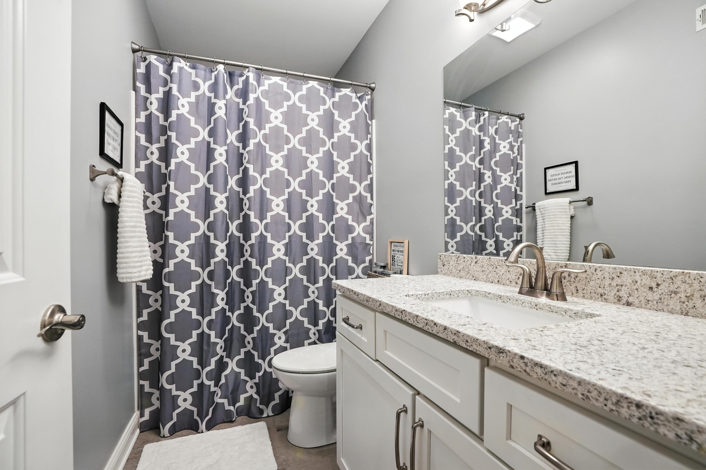 1285 Greenview Place Crown Point, IN 46307 - Photo 31 of 51 a bathroom with a granite countertop sink and a toilet