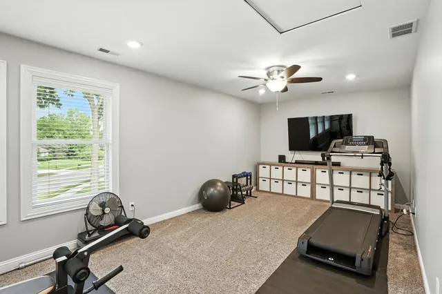 a room with gym equipment and a window