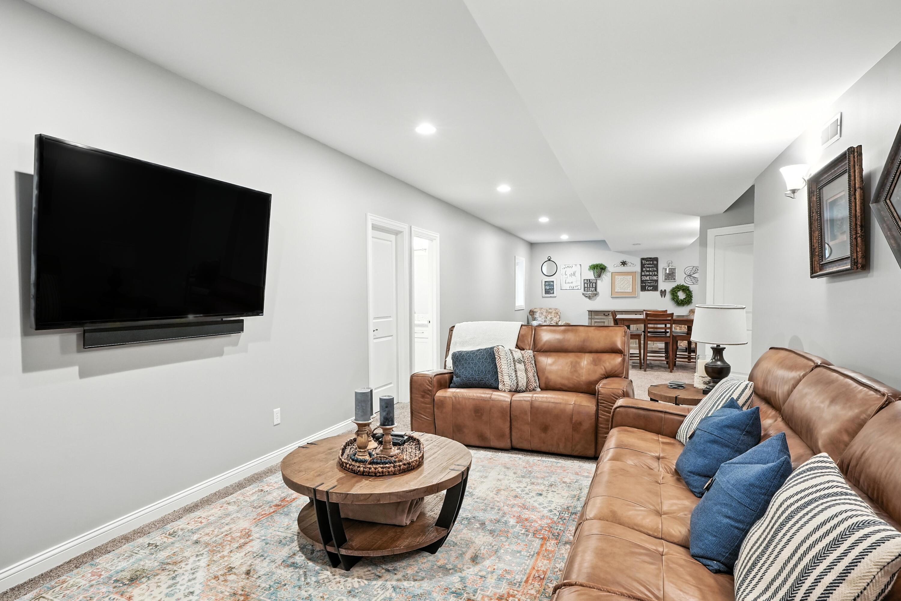1285 Greenview Place Crown Point, IN 46307 - Photo 36 of 51 a living room with furniture and a flat screen tv