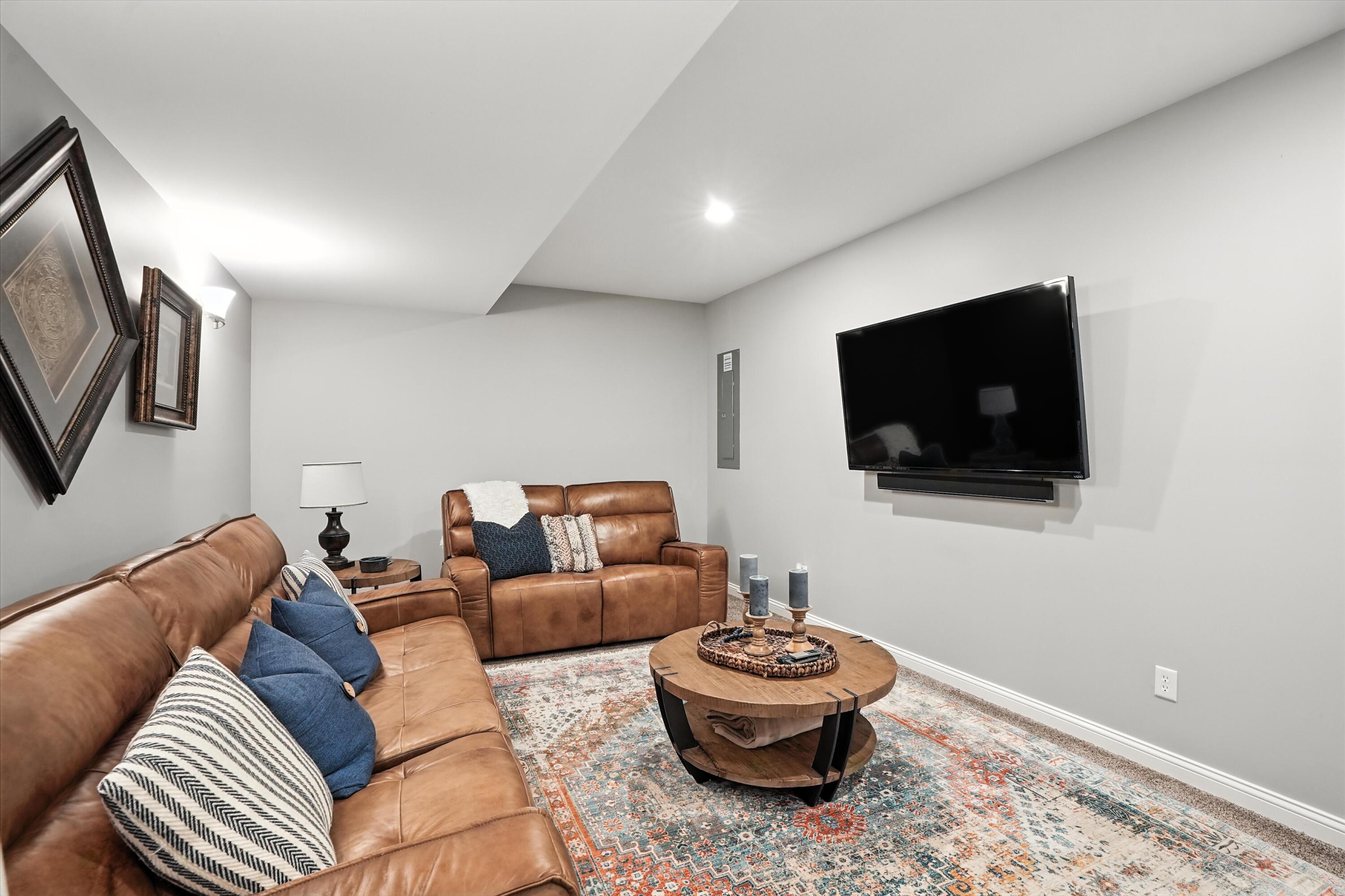 1285 Greenview Place Crown Point, IN 46307 - Photo 38 of 51 a living room with furniture and a flat screen tv