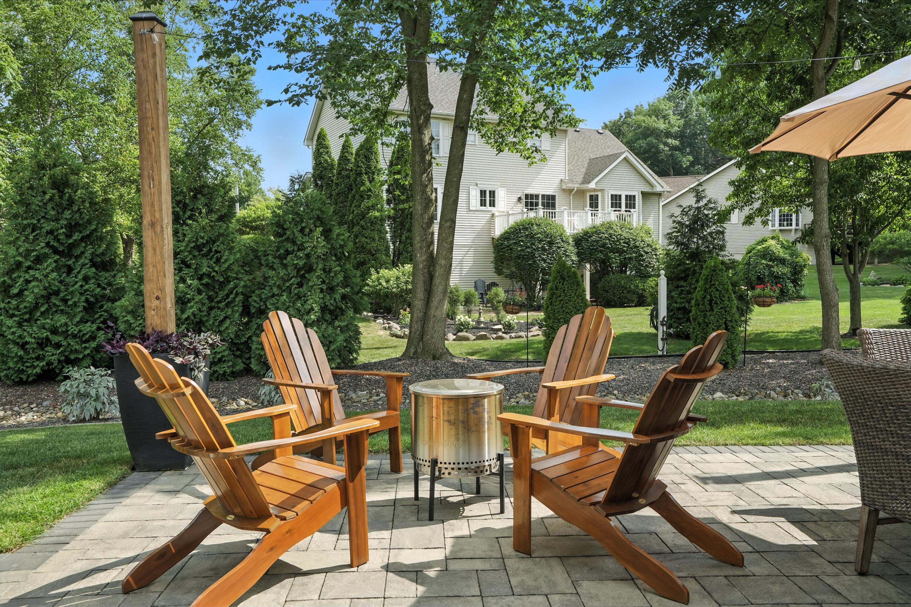 1285 Greenview Place Crown Point, IN 46307 - Photo 42 of 51 a view of a chairs and table in backyard of the house