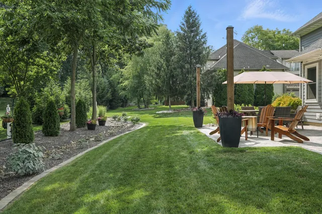 a view of an house with backyard space and garden