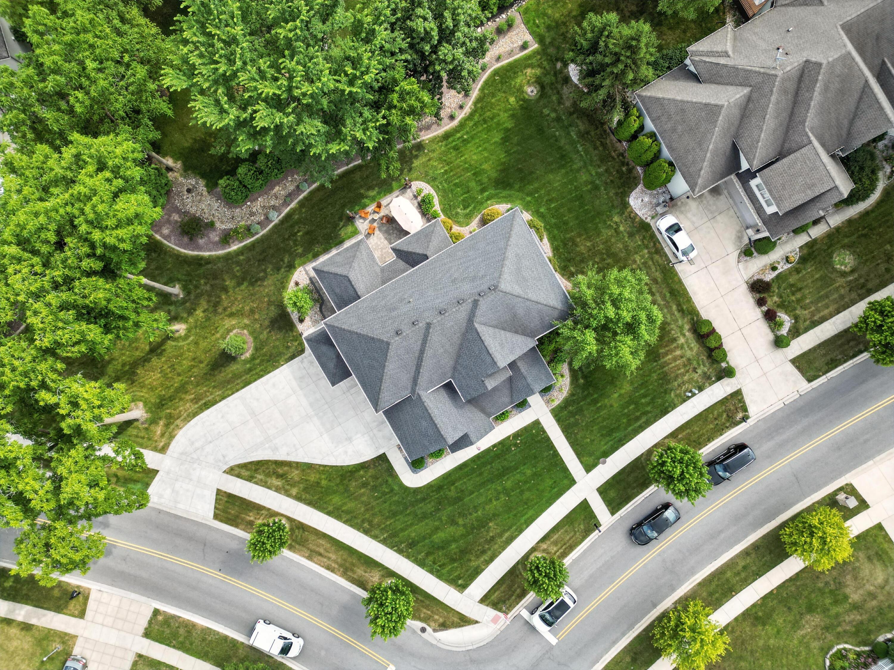 1285 Greenview Place Crown Point, IN 46307 - Photo 50 of 51 an aerial view of a house with a garden and trees