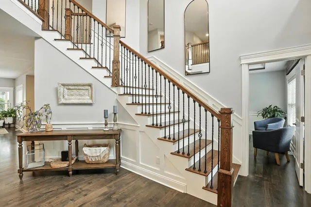 a view of entryway livingroom and hall with wooden floor