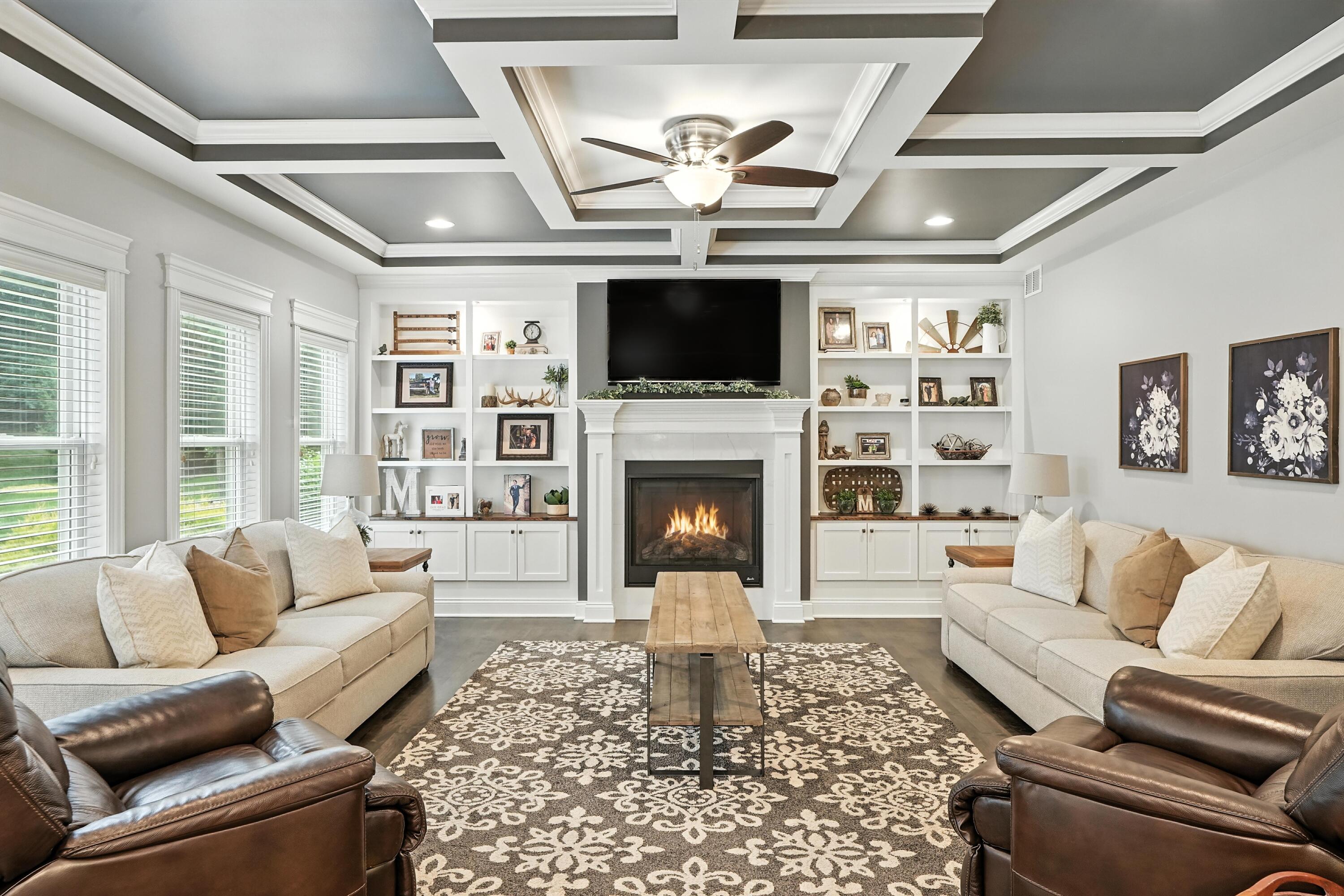 1285 Greenview Place Crown Point, IN 46307 - Photo 10 of 51 a living room with furniture a flat screen tv and a fireplace