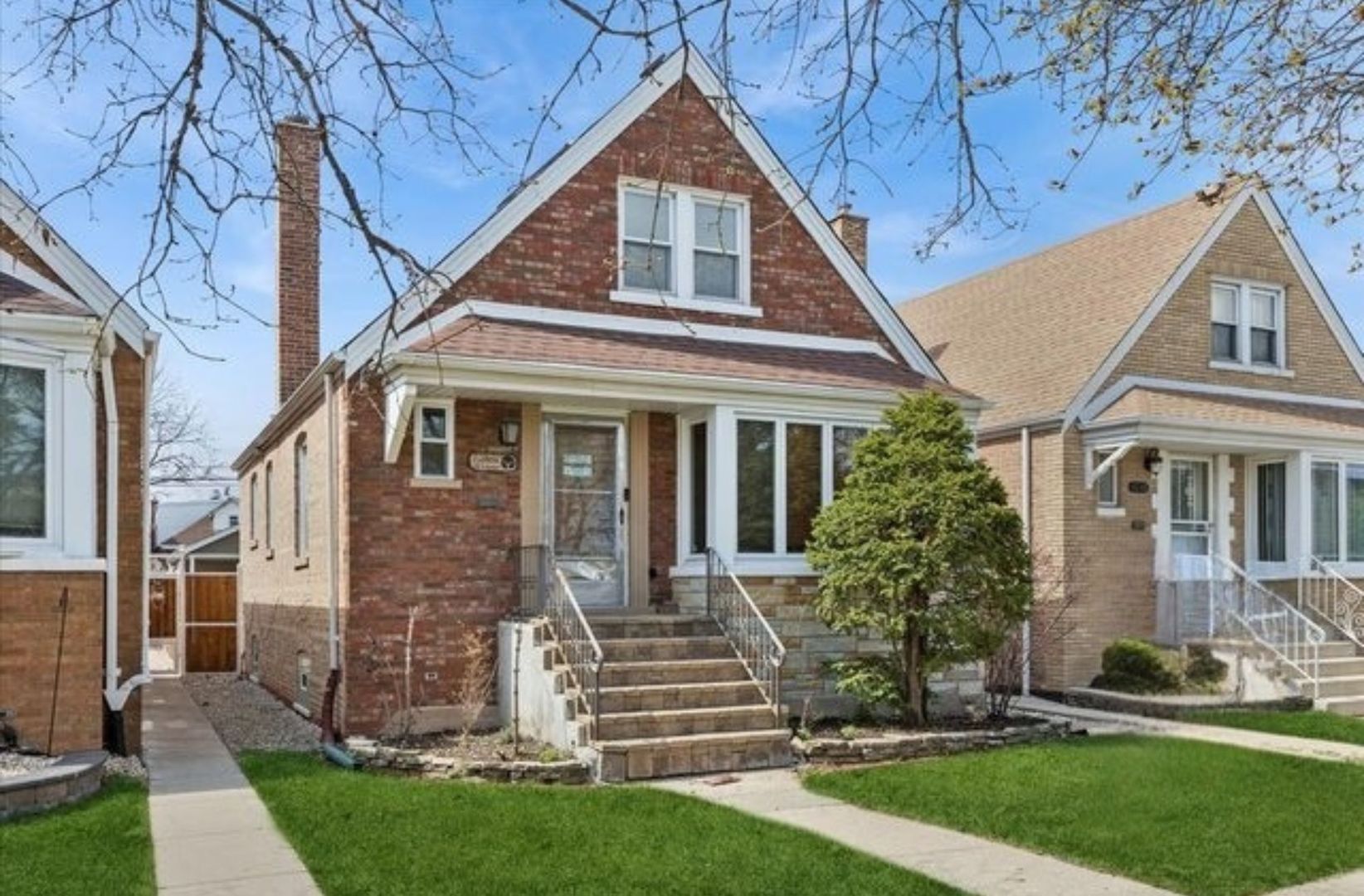 6140 South Kostner Avenue Chicago, IL 60629 - Photo 1 of 24 a front view of a house with a yard