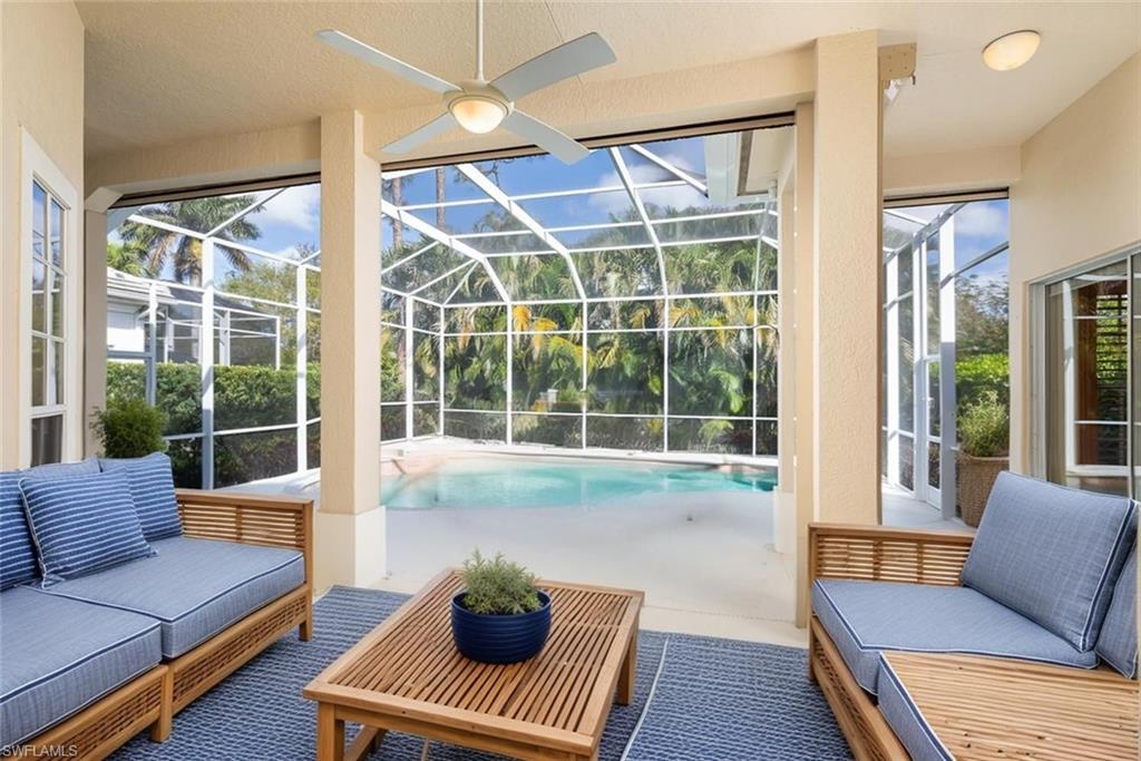 6900 Mill Run Road Naples, FL 34109 - Photo 16 of 31 a living room with furniture and a large window