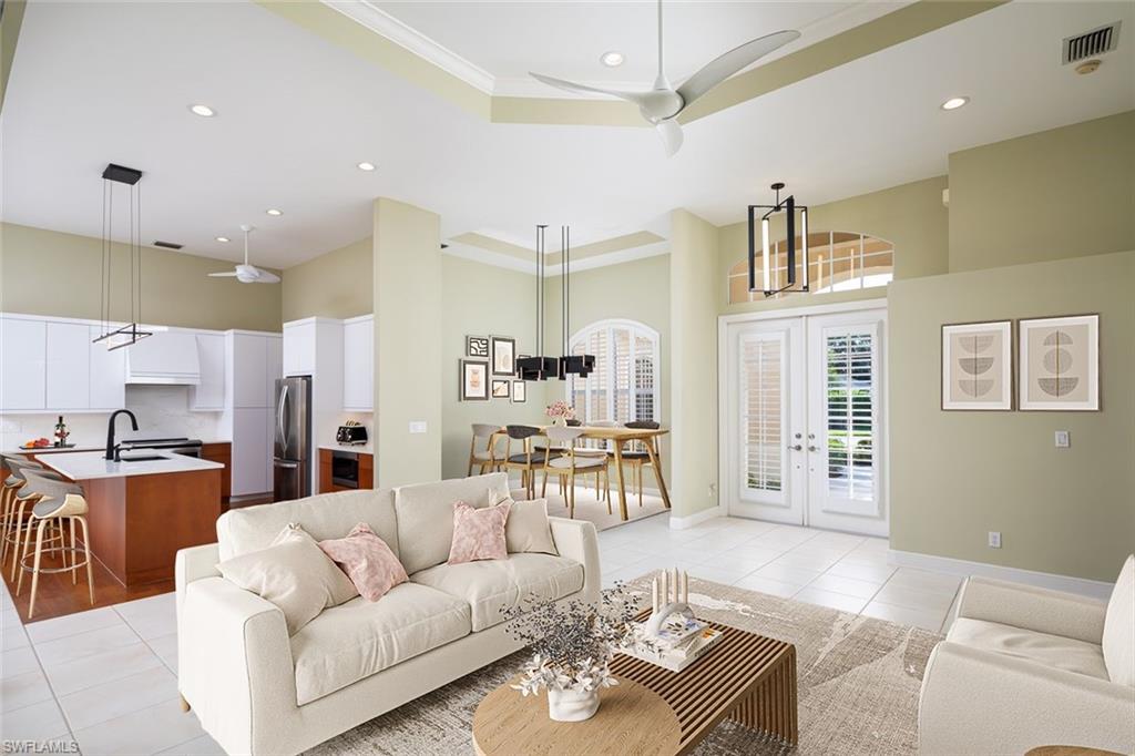 6900 Mill Run Road Naples, FL 34109 - Photo 20 of 31 a living room with furniture kitchen view and a chandelier