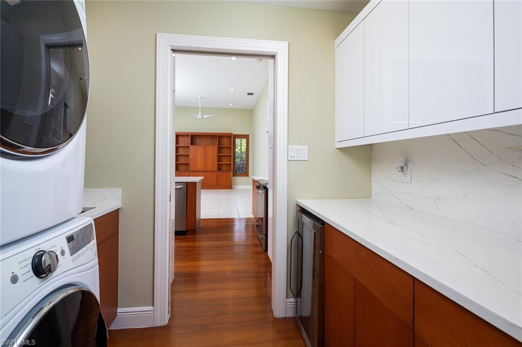 6900 Mill Run Road Naples, FL 34109 - Photo 24 of 31 a view of a kitchen with washer and dryer