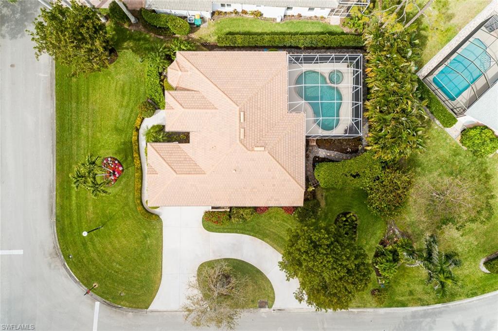 6900 Mill Run Road Naples, FL 34109 - Photo 5 of 31 an aerial view of a house with a swimming pool