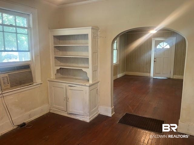 321 Grant Street Chickasaw, AL 36611 - Photo 11 of 13 Foyer entrance featuring arched walkways, dark wood finished floors, plenty of natural light, and ornamental molding