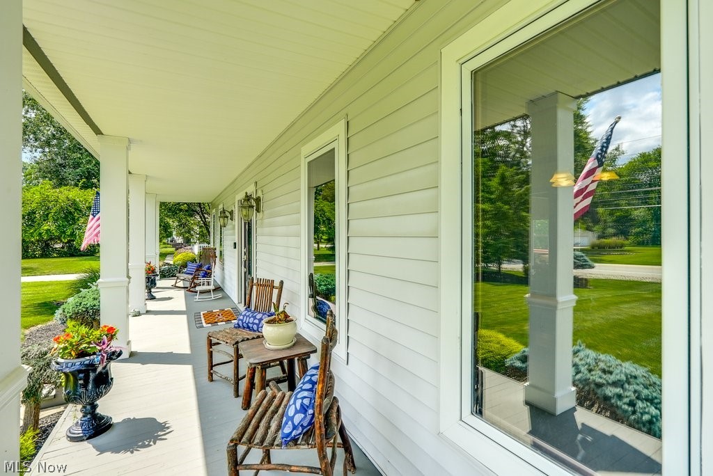 391 Barlow Road Hudson, OH 44236 - Photo 4 of 50 Quintessential front porch brings curb appeal and a relaxing place to retreat.