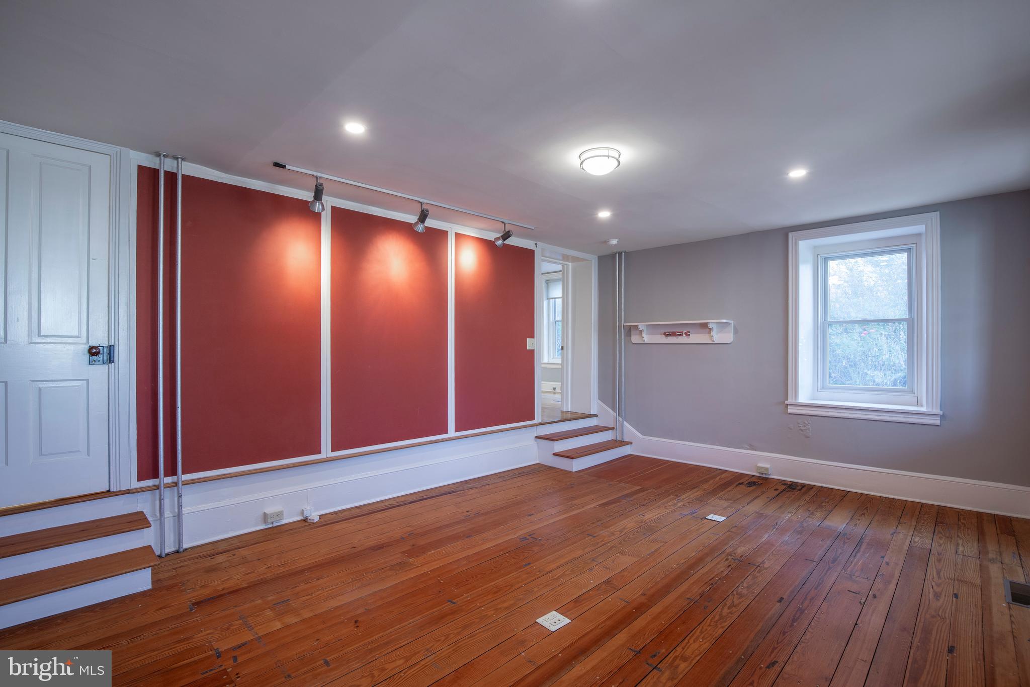 169 North Main Street Doylestown, PA 18901 - Photo 19 of 53 a view of an empty room with wooden floor and window