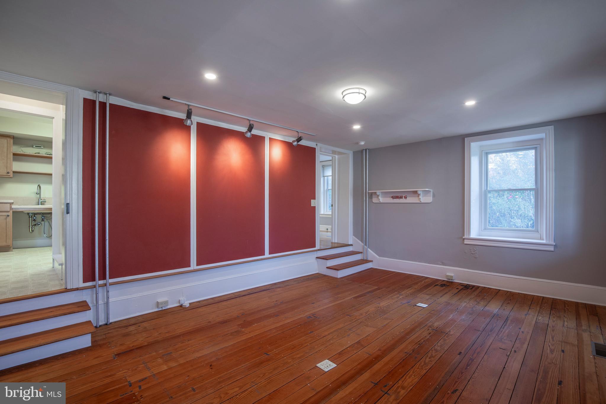 169 North Main Street Doylestown, PA 18901 - Photo 20 of 53 a view of an empty room with wooden floor and window