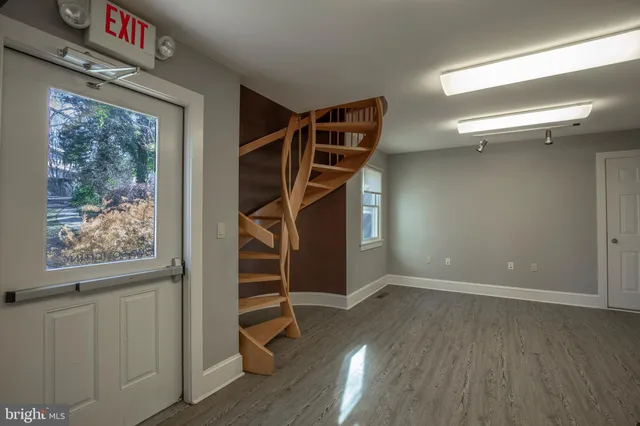 a view of hallway with wooden floor