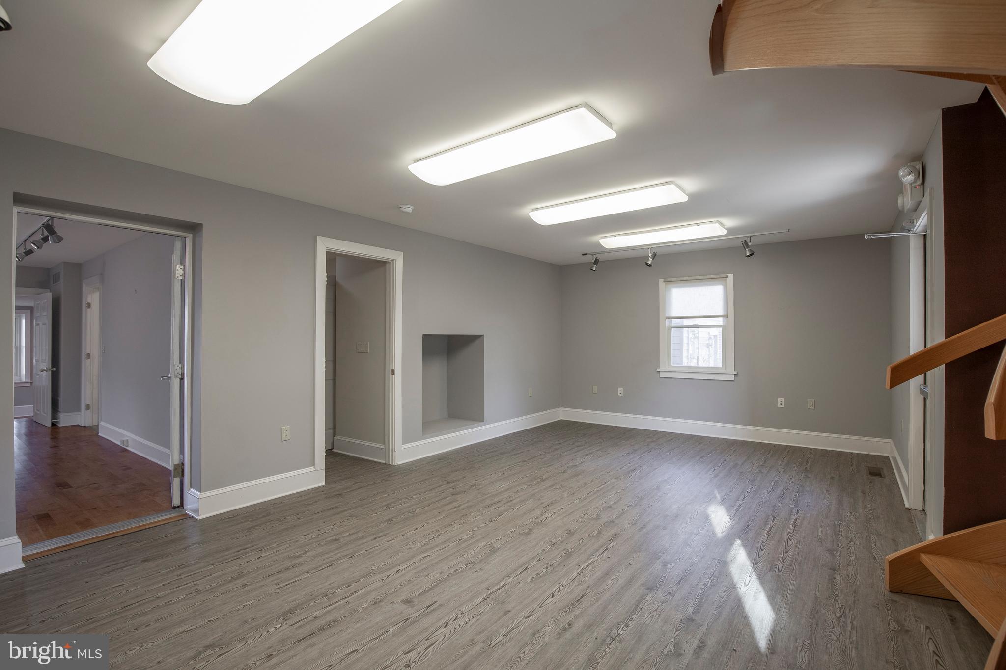 169 North Main Street Doylestown, PA 18901 - Photo 35 of 53 an empty room with wooden floor and windows