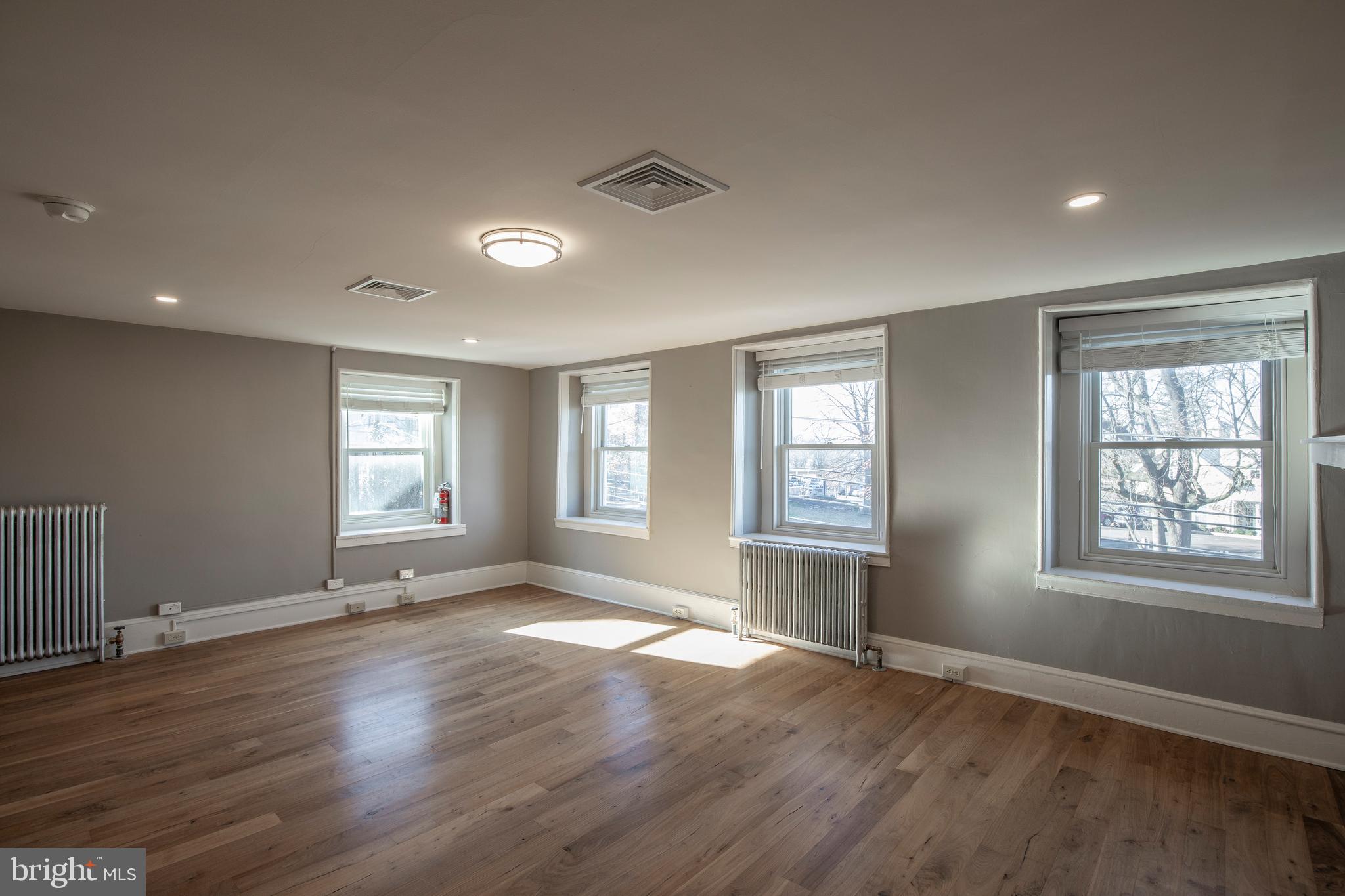 169 North Main Street Doylestown, PA 18901 - Photo 38 of 53 a view of an empty room with wooden floor and a window