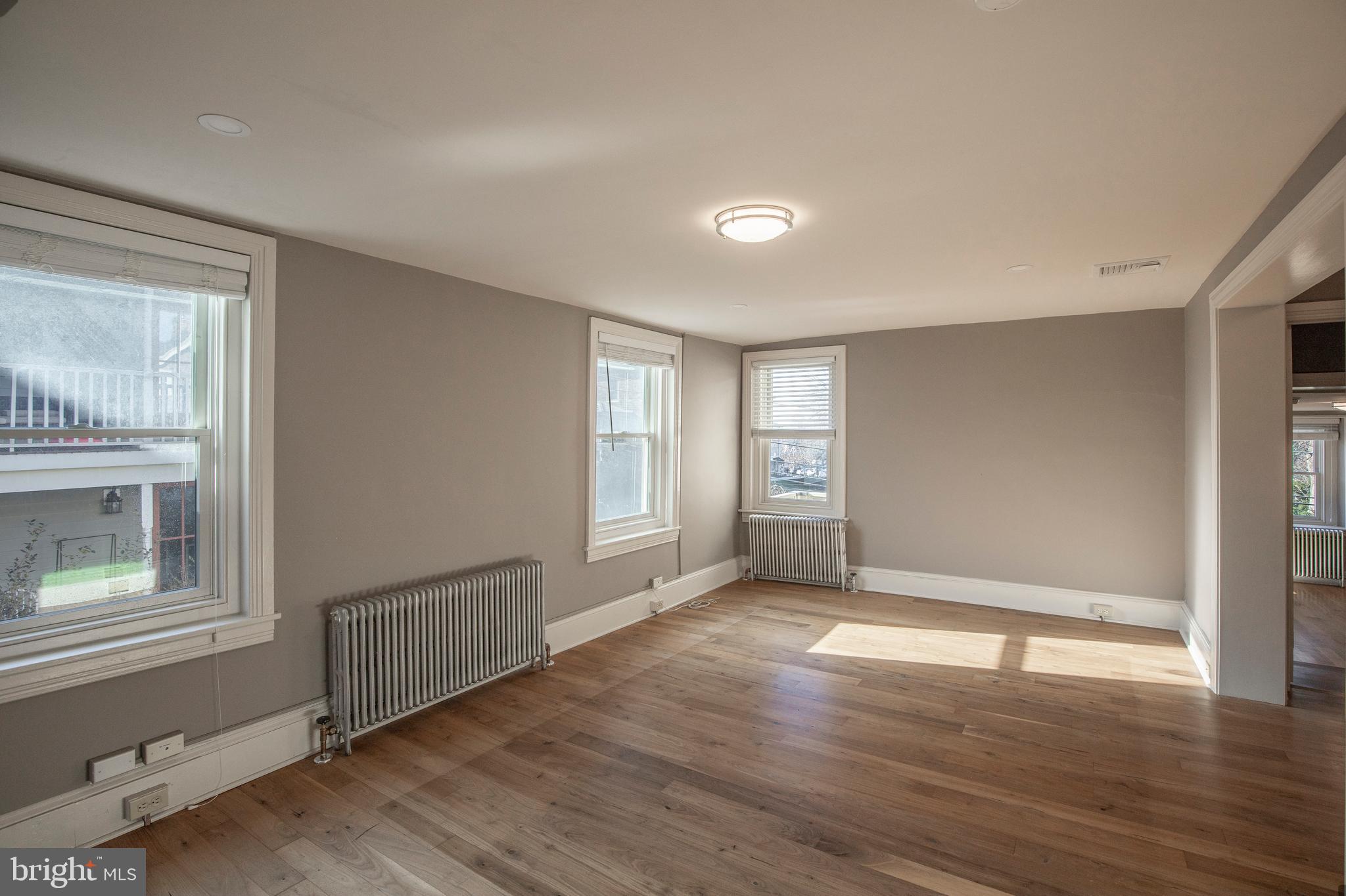 169 North Main Street Doylestown, PA 18901 - Photo 43 of 53 a view of an empty room with wooden floor and a window